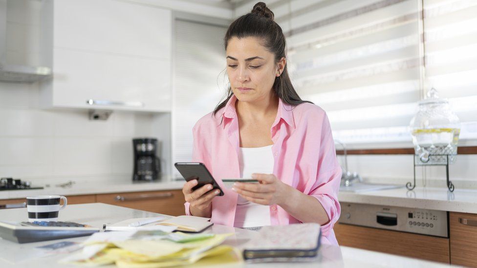 Woman looking at bills