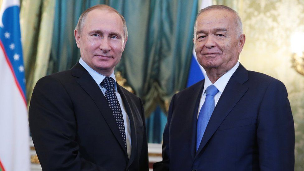 Russia's president Vladimir Putin (L) and Uzbekistan's president Islam Karimov