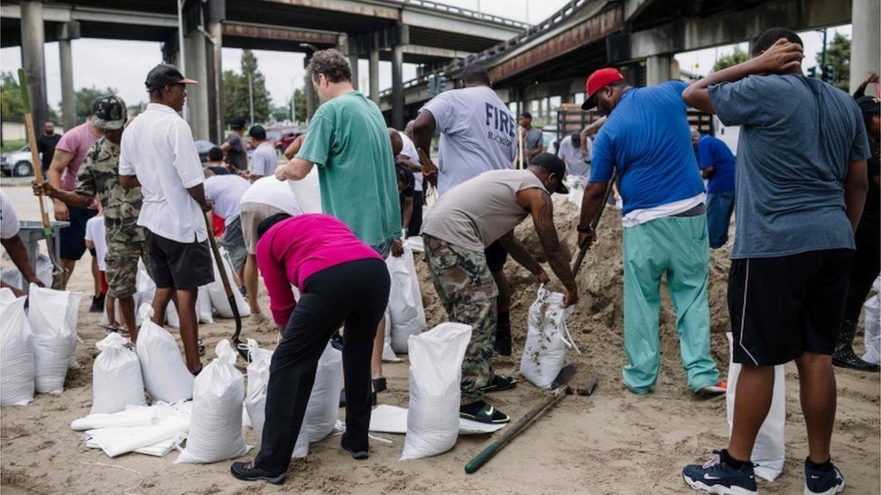 People fill sandbags as they prepare for Hurricane Nate in New Orleans, 7 October 2017