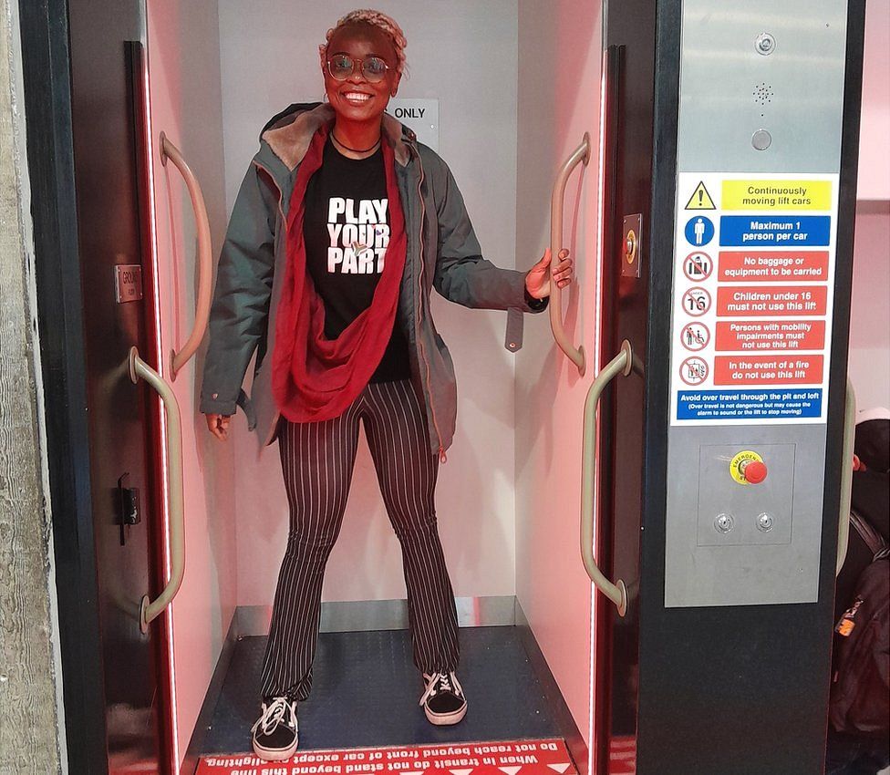 A student on the Paternoster lift at the University of Essex