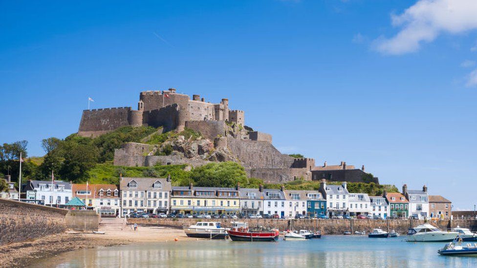 Mount Orgueil Castle overlooking the harbour and bay at Gorey on the east coast of Jersey