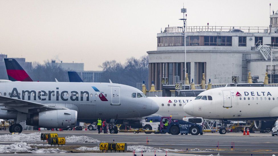 Jets parked on the tarmac of Ronald Reagan Washington National Airport in Arlington, Virginia, USA, 14 January 2022.