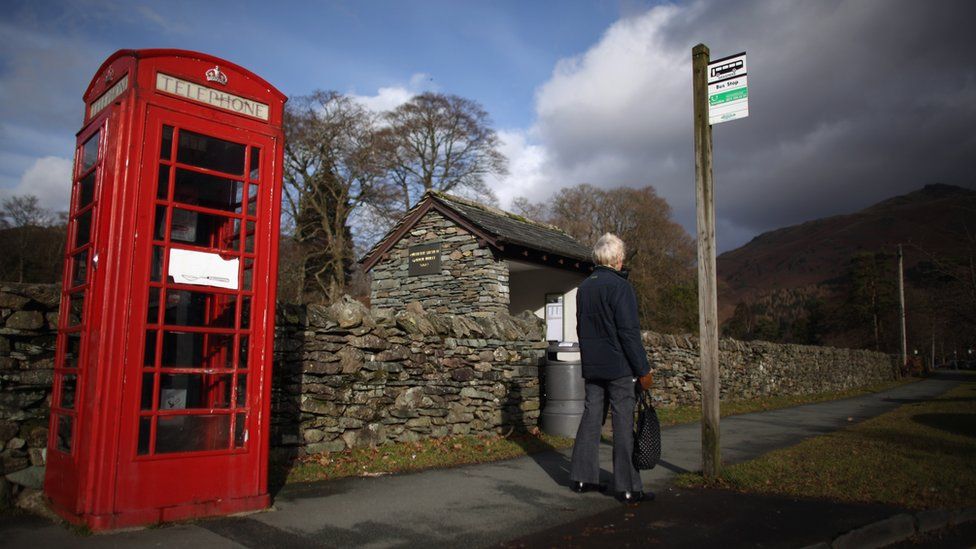 Woman waits for the bus in Grassmere