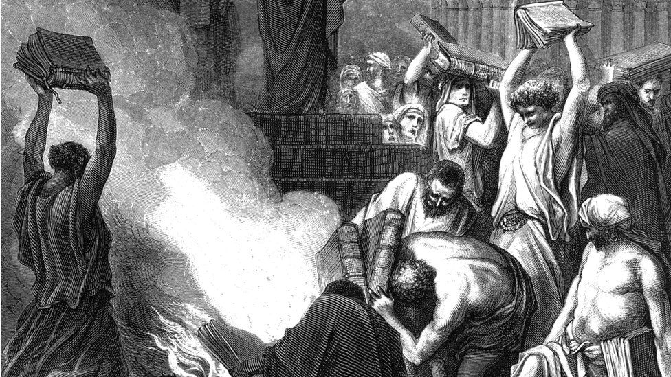 Pagan books are burned at Ephesus. Acts 19 illustration was published in 'bible or books of new testament and old testament'(1875)