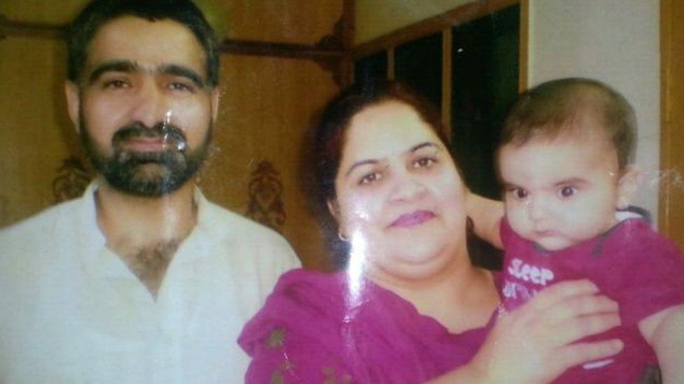 Gulzar Ahmad Tantray with his wife and child in Pakistan-administered Kashmir