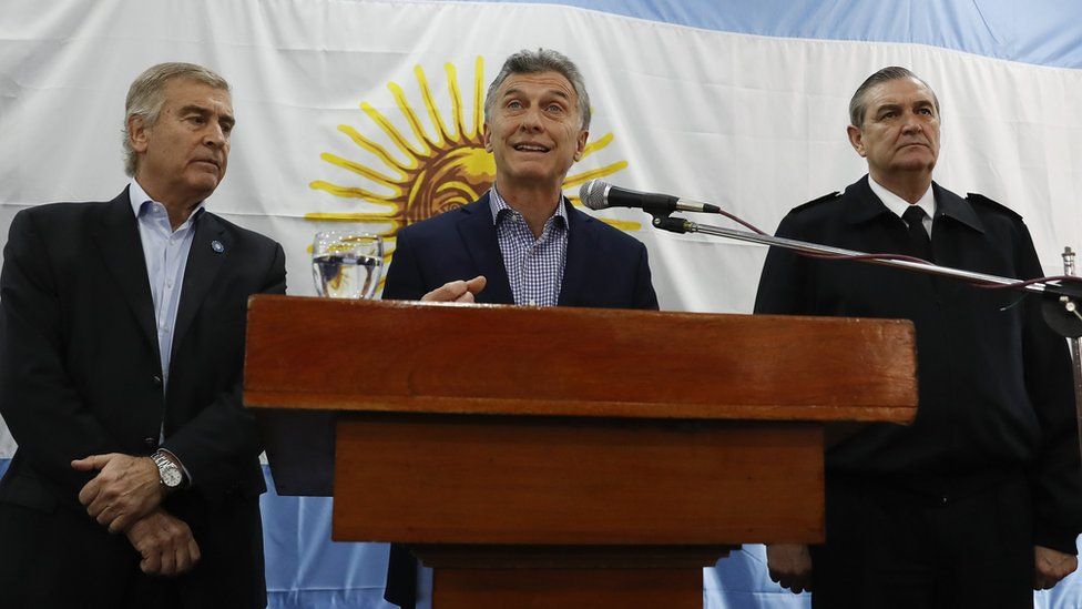 Argentine President Mauricio Macri (C) and Defence Minister Oscar Aguad (L) address a press conference at navy headquarters in Buenos Aires, Argentina, 24 November 2017.