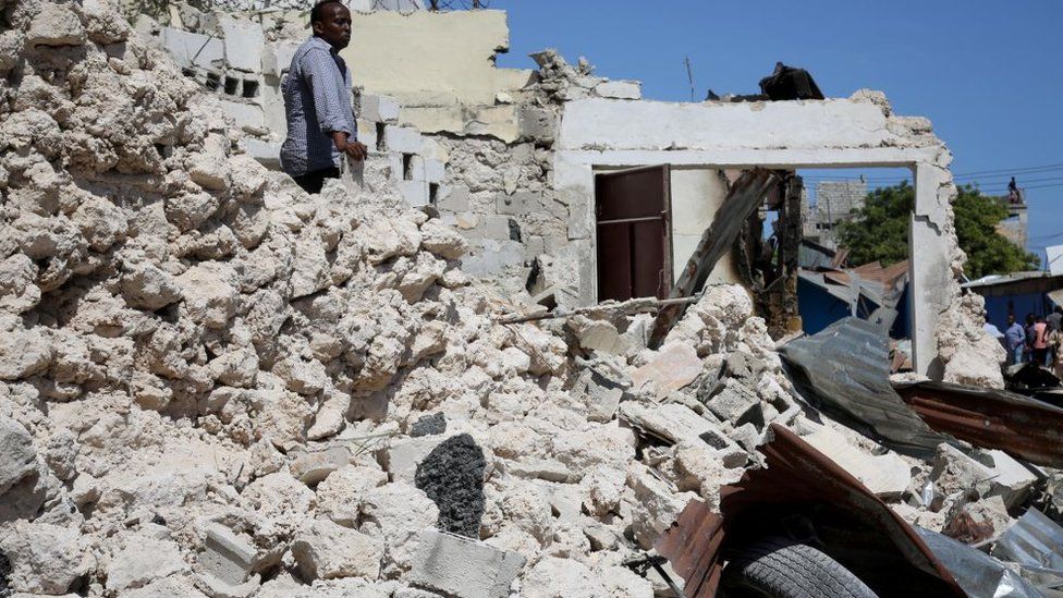 A view of damage at the scene after a suicide car blast targeted a security convoy in Mogadishu, Somalia on January 12, 2022