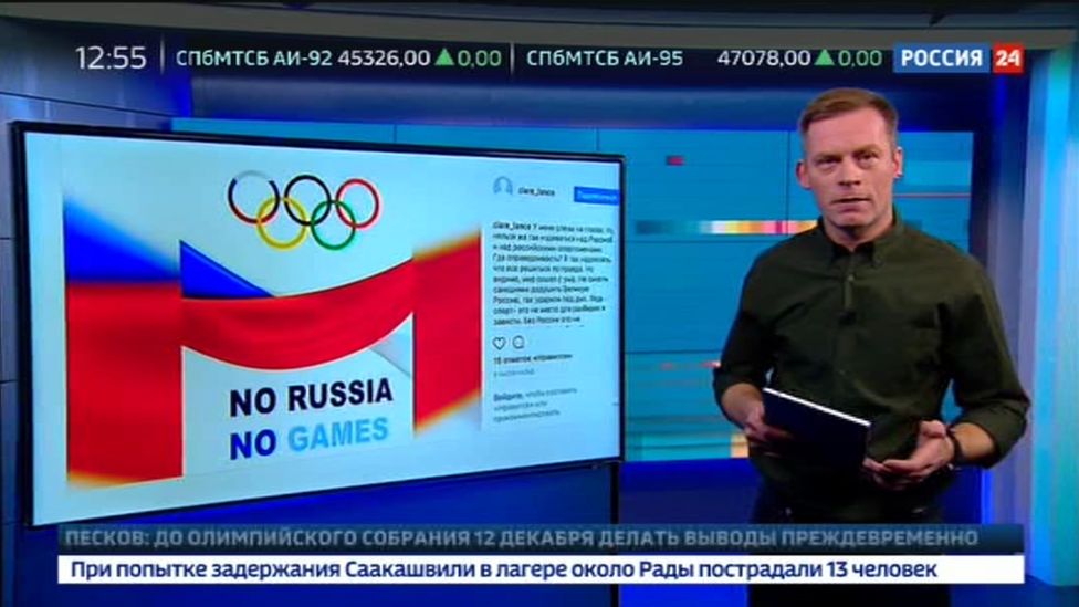 A Russian TV presenter speaks to camera on state rolling news channel Rossiya 24.