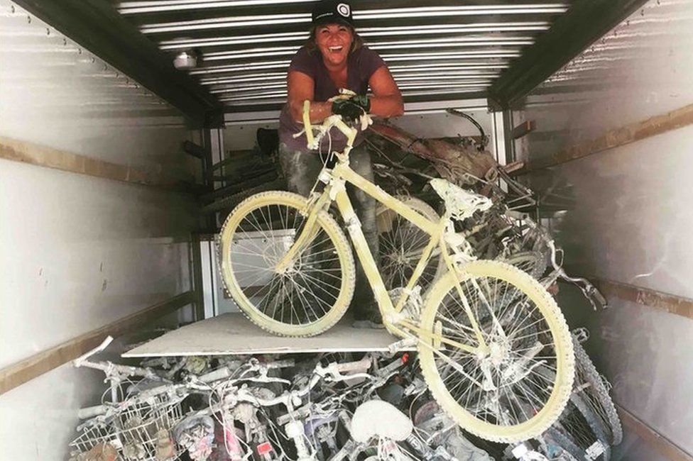 Meg Kiihne loads up a truck with bicycles in the Black Rock Desert