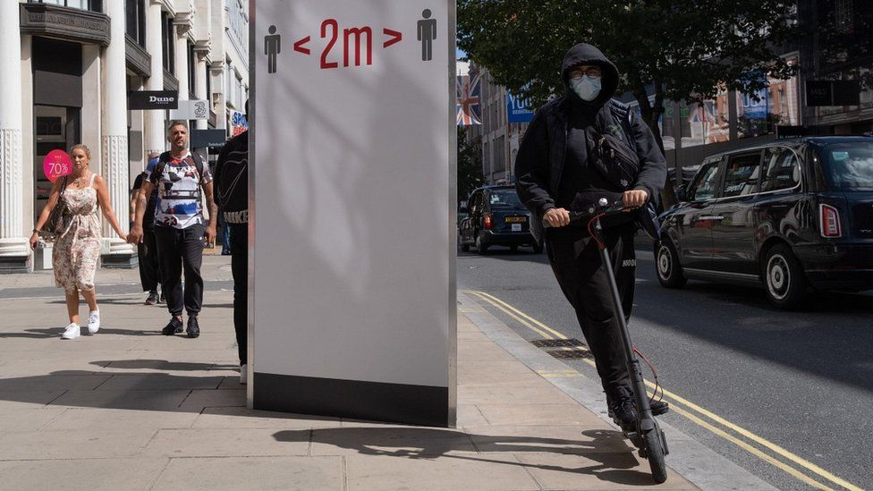 Man on e-scooter on Oxford Street