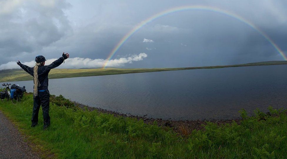 Paul looks at a rainbow