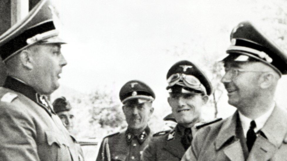 Heinrich Himmler (right), a five-star general, during a visit to the Auschwitz camp in Poland, where he inspects the Monowitz-factories. 18th July 1942