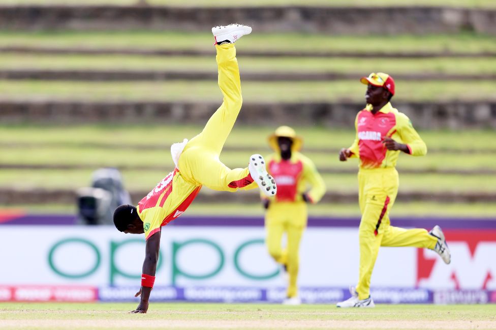 Ugandan cricket Christopher Kidega does a cartwheel after a wicket in a ICC U19 World Cup match in Tarouba, Trinidad And Tobago - Saturday 22 January 2022
