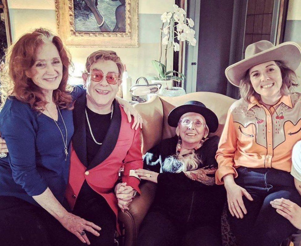 Mitchell welcomed other musicians into her home during her recovery, including (L-R) Bonnie Raitt, Sir Elton John and Brandi Carlile