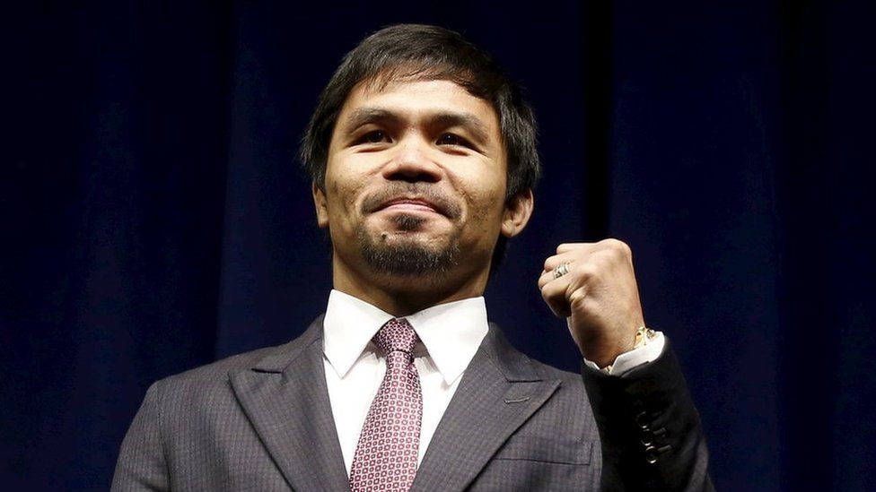 Eight-division world champion Manny "Pac-Man" Pacquiao attends a news conference ahead of his upcoming bout with five-division world boxing champion Floyd "Money" Mayweather (not seen), in Los Angeles, California in this 11 March 2015 file photo