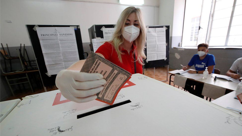 A woman casts a vote in the election