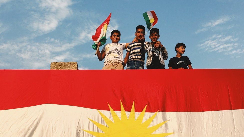 Young Kurds gather at a rally in favour of independence