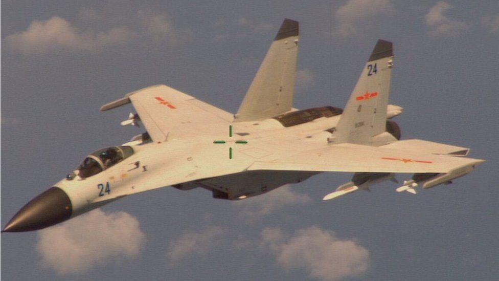 The Chinese jet fighter Shenyang J-11B, as seen from a US Navy P-8 Poseidon surveillance airplane on 19 August 2014.