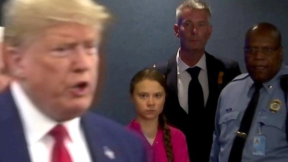 Greta Thunberg watches as U.S. President Donald Trump enters the United Nations in 2019