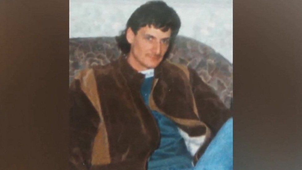 David Boyd in 1992, wearing a brown jacket and with long brown hair