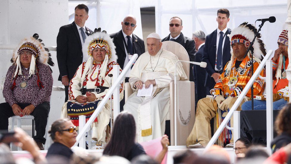 Pope Francis speaks alongside indigenous chiefs in Alberta.