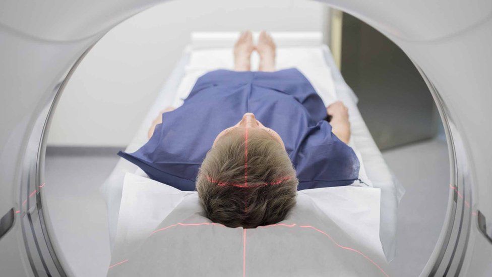 Man in a CT scanner