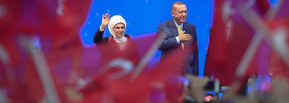 Turkish President Recep Tayyip Erdogan and his wife Emine Erdogan wave during a pre-election rally in Sarajevo, on May 20, 2018