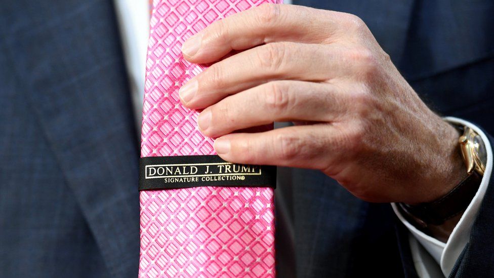 Australian Prime Minister Malcolm Turnbull displays his Donald Trump branded pink tie