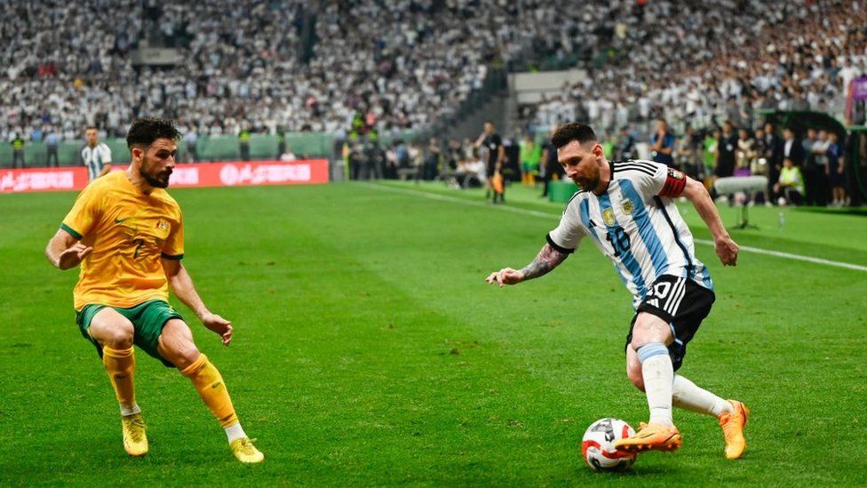 Lionel Messi takes on an Australian player at the match on Thursday night