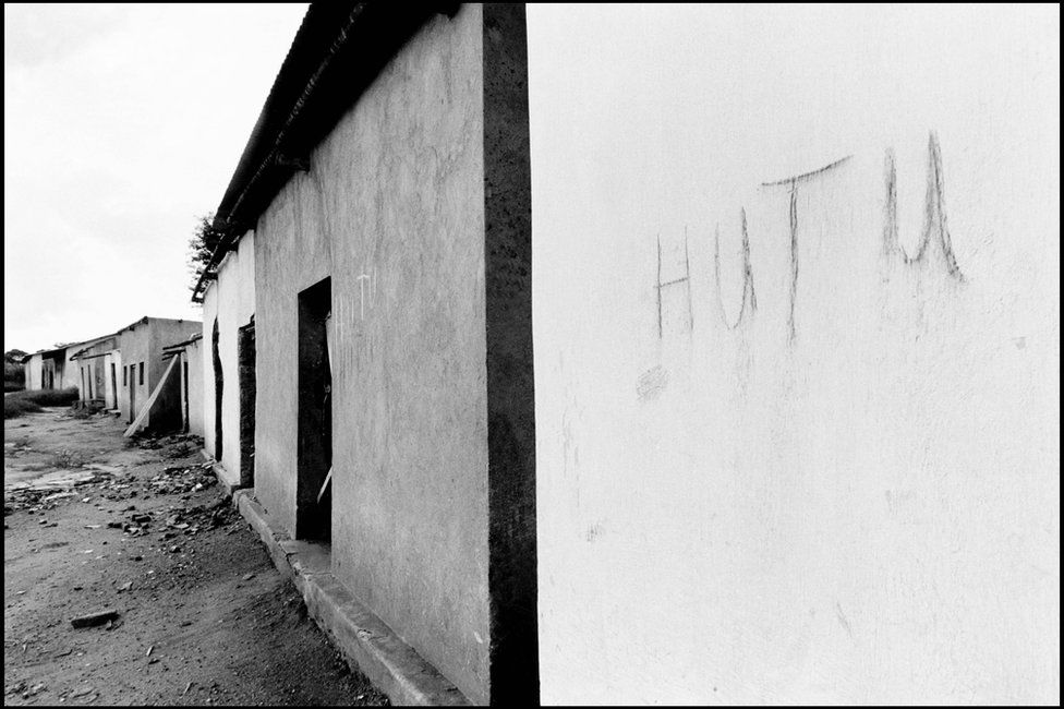 A wall with the word "Hutu" written on. Hutus living in this house scrawled their ethnicity on the wall to prevent looting