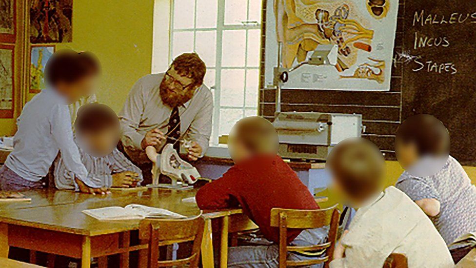 Ron Morris teaching boys in a classroom