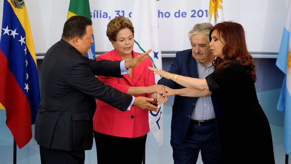 Brazilian President Dilma Rousseff (2nd-L) holds hands with the presidents of Uruguay, Jose Mujica (2nd- R), Argentina, Cristina Kirchner (R), and Venezuela, Hugo Chavez ( L), before the Mercosur Extraordinary Summit, at Planalto Palace, in Brasilia, on July 31, 2012