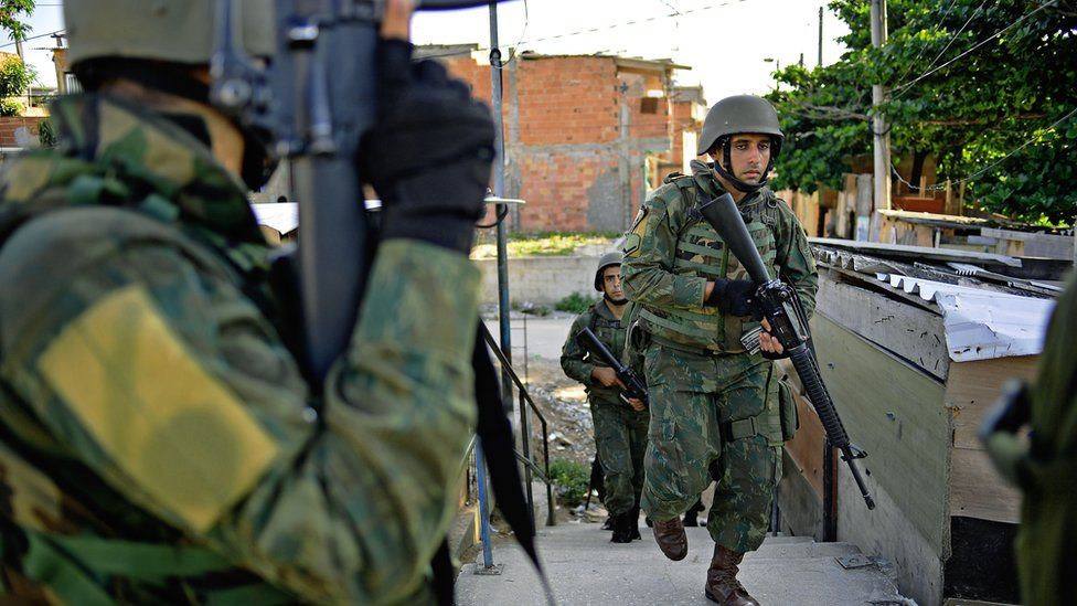 Brazilian military patrol in Jacarezinho favela in Rio de Janeiro on January 18, 2018.