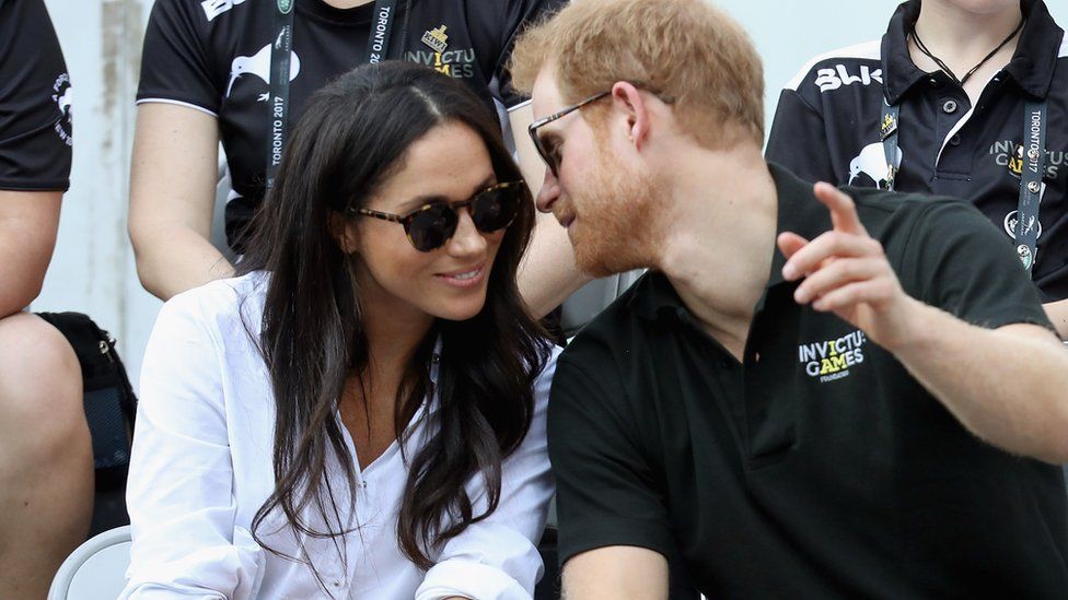 Prince Harry speaks to Meghan Markle at an Invictus Games event in September 2017
