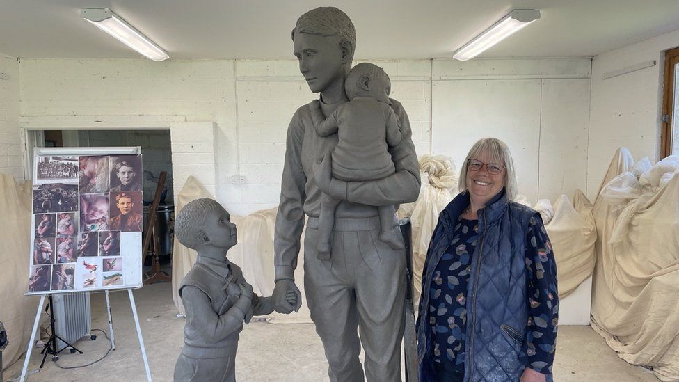 Sculptor Moira Purver with lifesize clay model for the statue of Trevor Chadwick