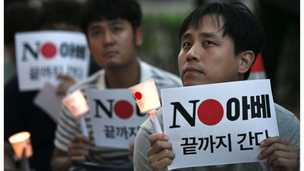 South Korean protesters hold signs reading "No Abe" during a rally in Seoul on 1 August denouncing Japan for its recent trade restrictions against Seoul