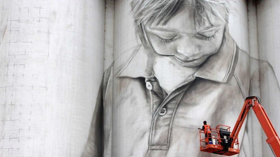 A portrait of a local schoolgirl painted on the side of a grain silo in Coonalpyn, South Australia