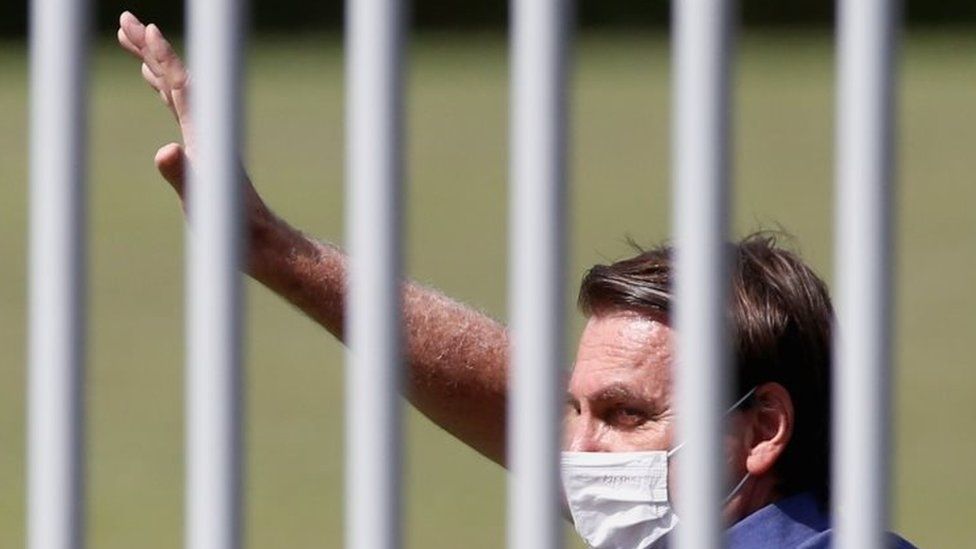 Brazilian President Jair Bolsonaro waves to his supporters in Brasilia, Brazil. Photo: 21 March 2021