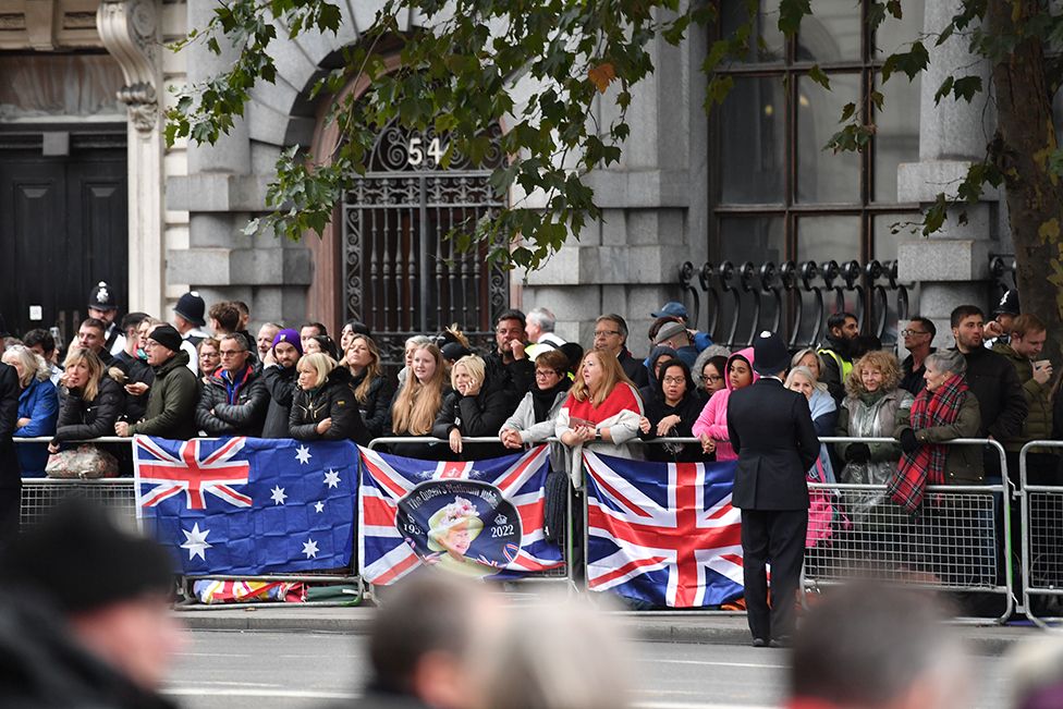 People wait to watch the State Funeral Procession of Queen Elizabeth II on 19 September 2022