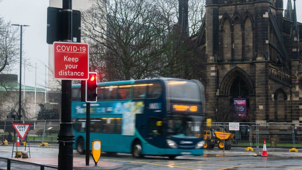 A bus travels past St Thomas' Church in Newcastle city centre