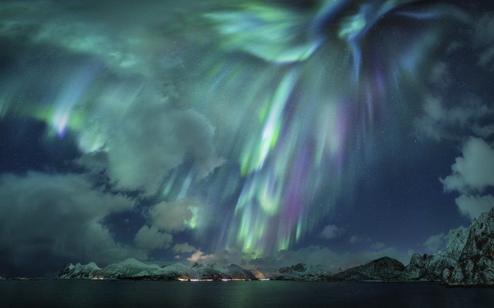 An image of night sky in Norway with bright aurorae