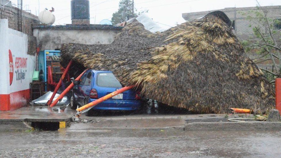 A roof collapsed on top of a car in Tecuala, Nayarit state