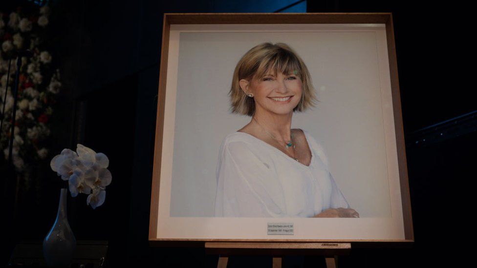 A portrait of Olivia Newton-John on display at a memorial service in Melbourne