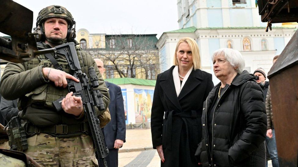 US Treasury Secretary Janet Yellen (R) and US ambassador to Ukraine Bridget Brink look at destroyed Russian military vehicles displayed in an exhibition in Kyiv