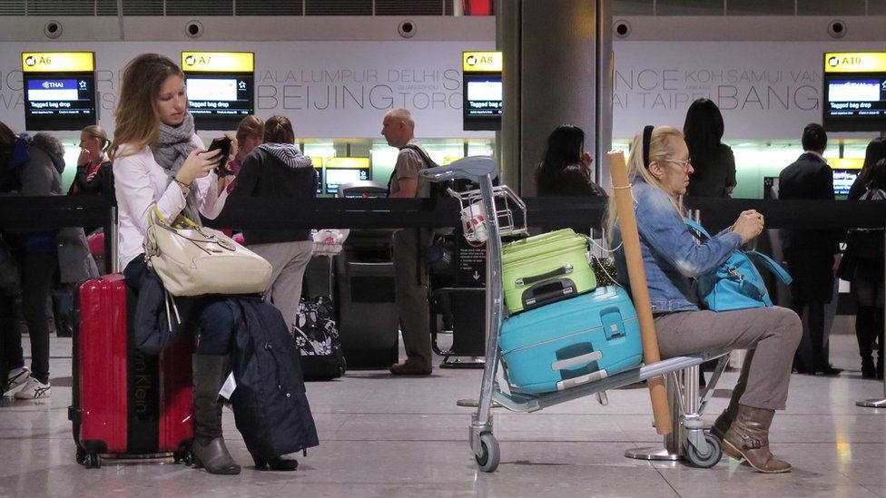 Travellers at Heathrow airport