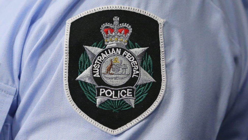 A close up of the Australian Federal Police badge