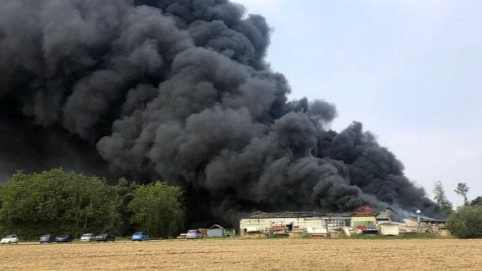 Parham fire: Overheated machinery caused airfield blaze - BBC News