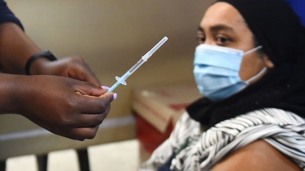 A woman is vaccinated