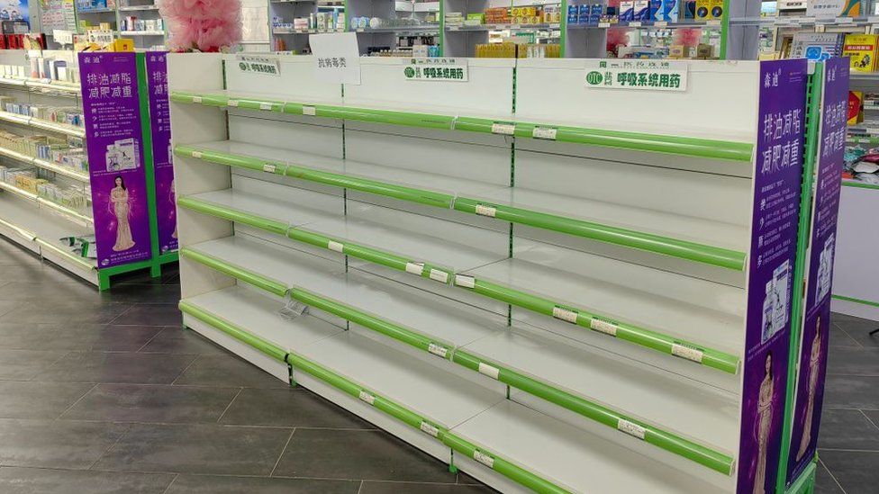Empty medication shelves at a pharmacy in Xi'an