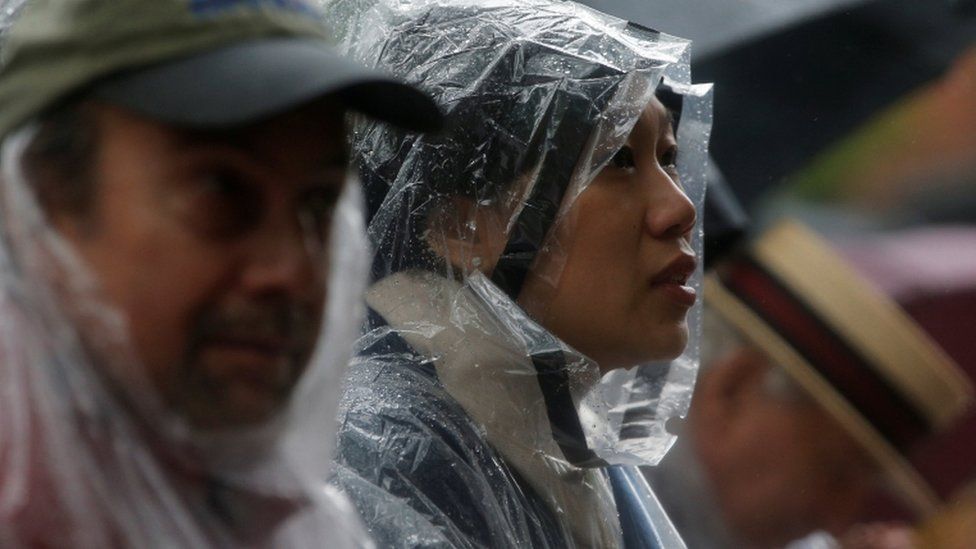 Priscilla Chan in rain gear
